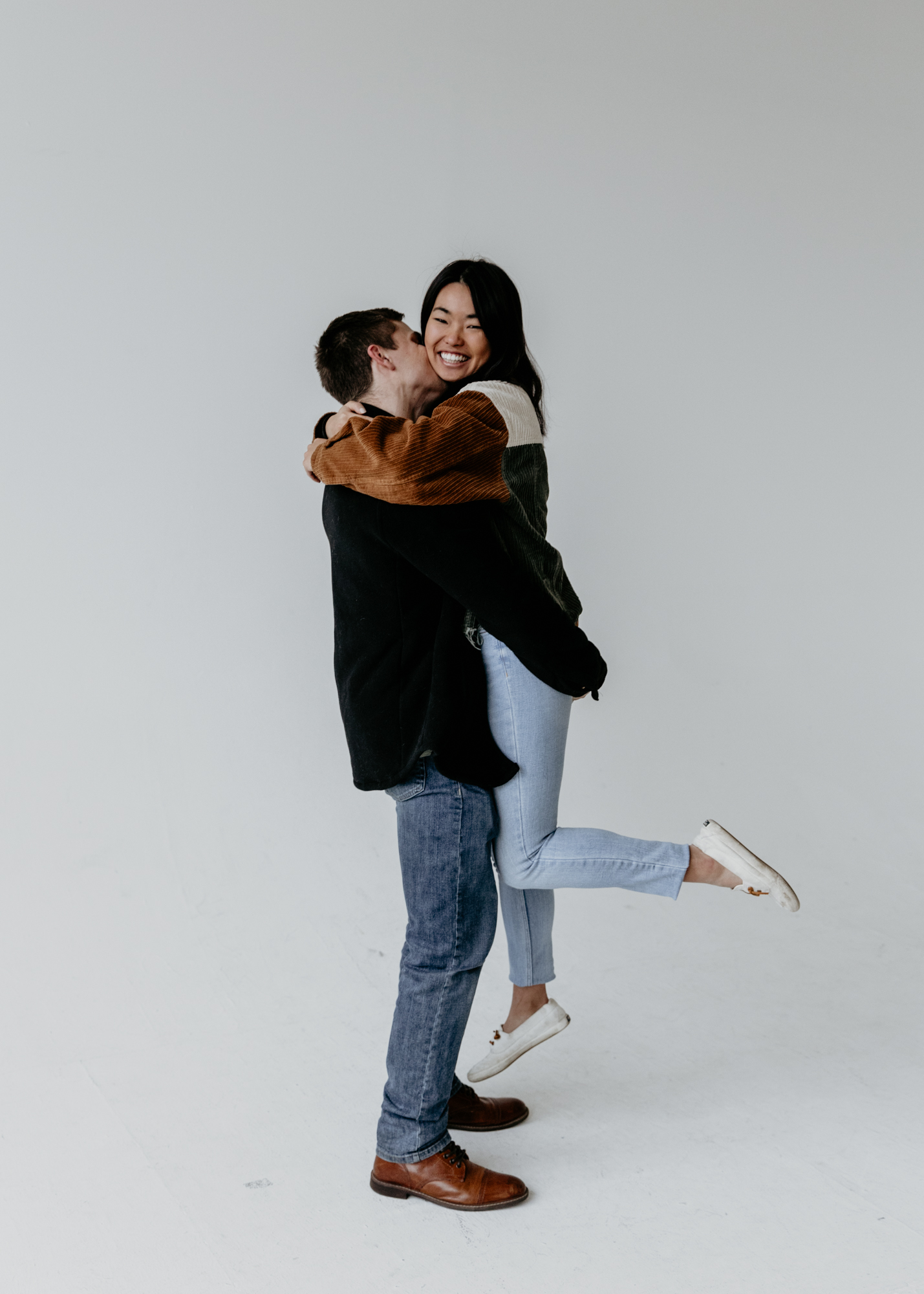 Couple hugging engagement photos poses in brooklyn NYC with brooklyn wedding photographer