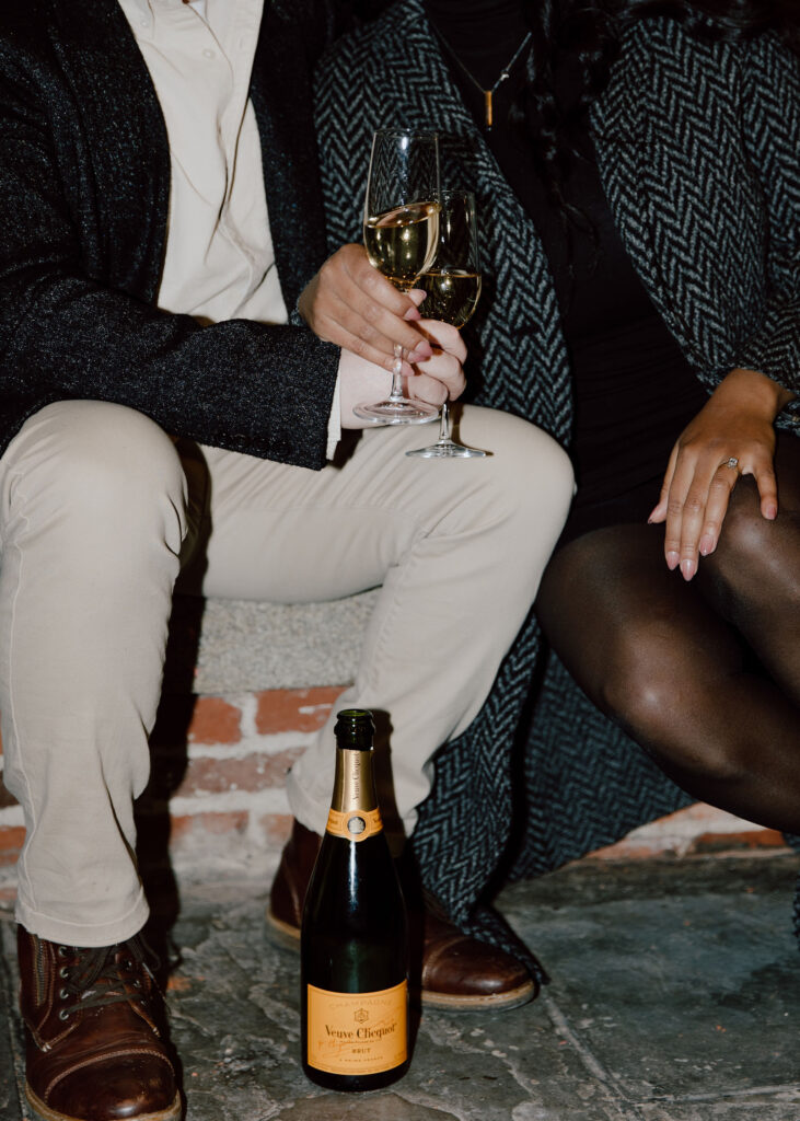 Champagne toast photo during the couples New York city engagement session