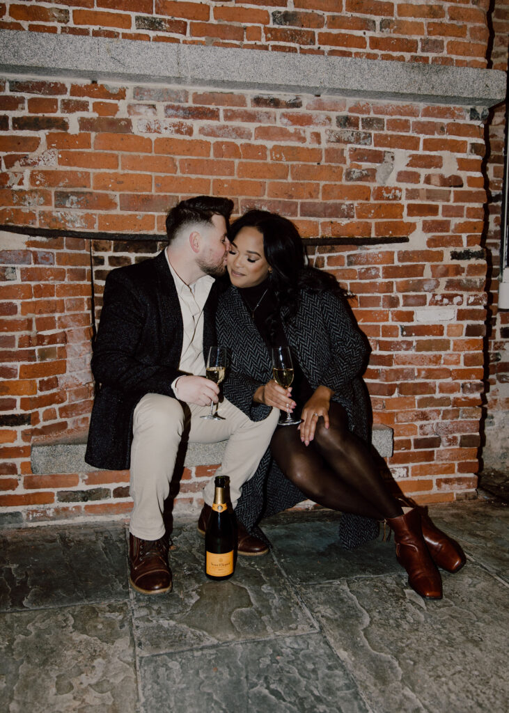 Champagne toast photo during the couples New York city engagement session