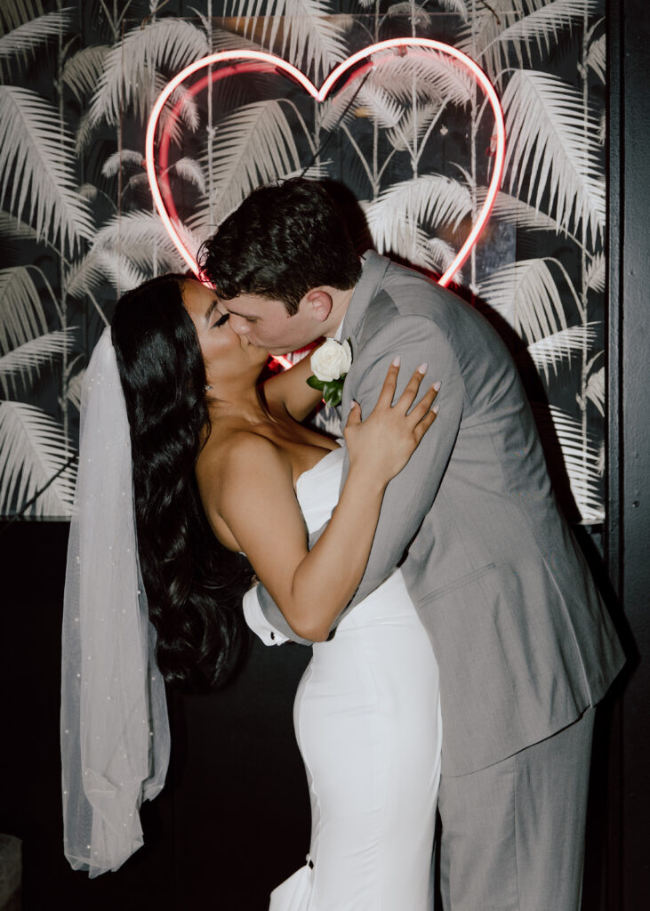 Bride and groom kissing at 501 Union Brooklyn