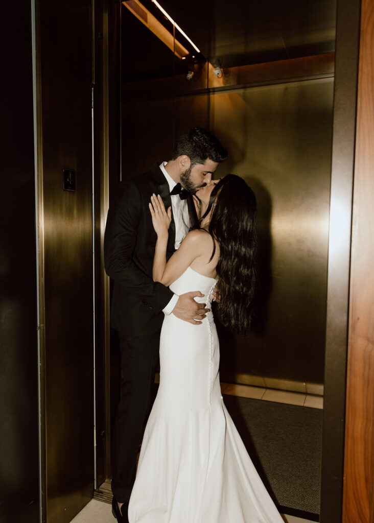 Bride and groom photo in an elevator during their New York hotel wedding photoshoot
