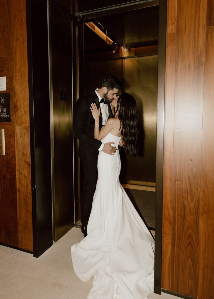 Bride and groom photo in an elevator during their New York hotel wedding photoshoot