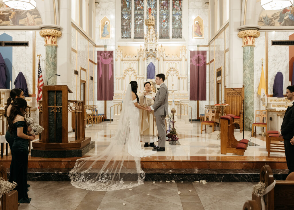 A traditional wedding ceremony at Our Lady of Mount Carmel Catholic Church in Queens