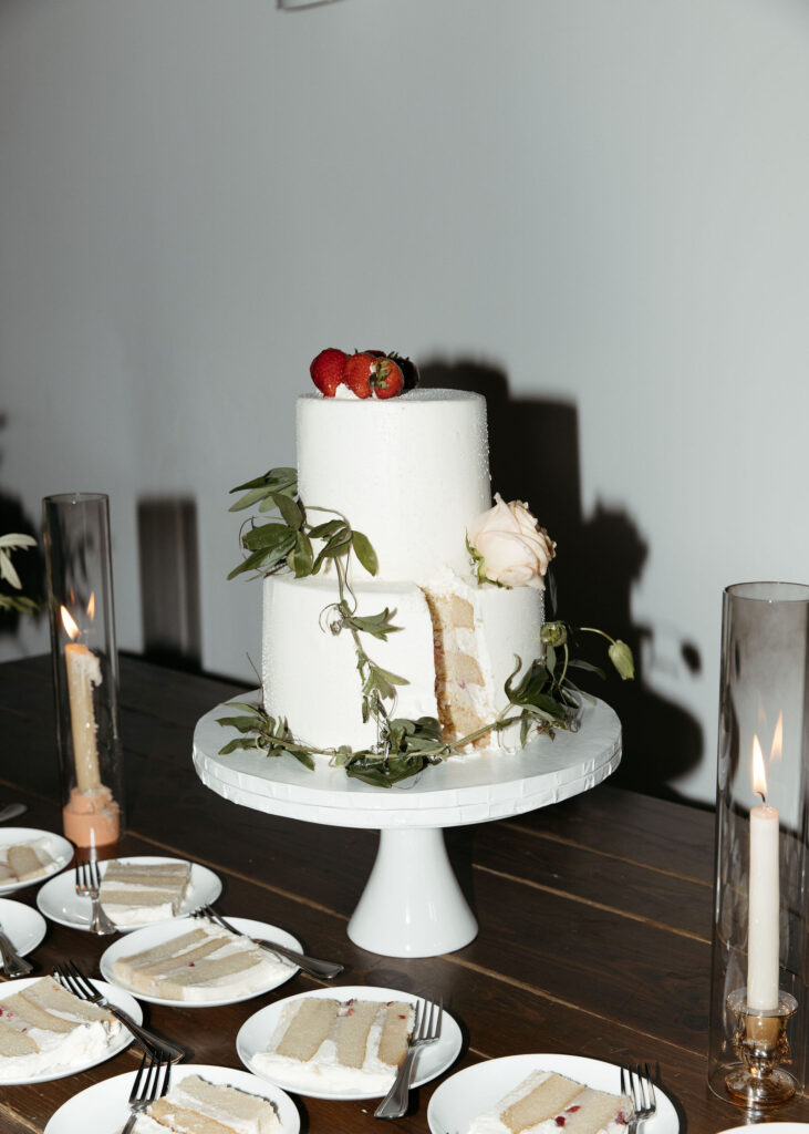 bride and groom cutting cake