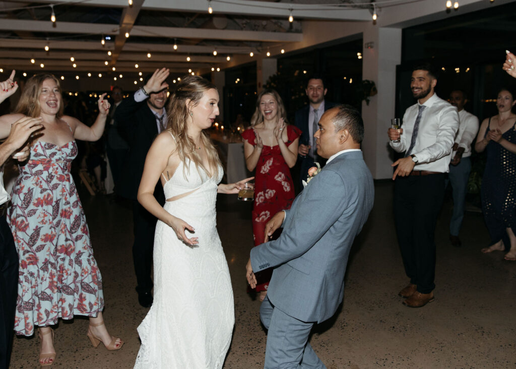 bride and groom dancing and having fun at their wedding reception