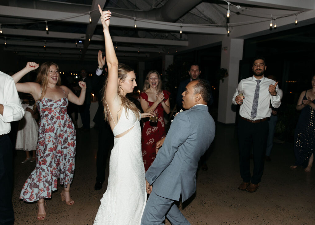 bride and groom dancing and having fun at their wedding reception