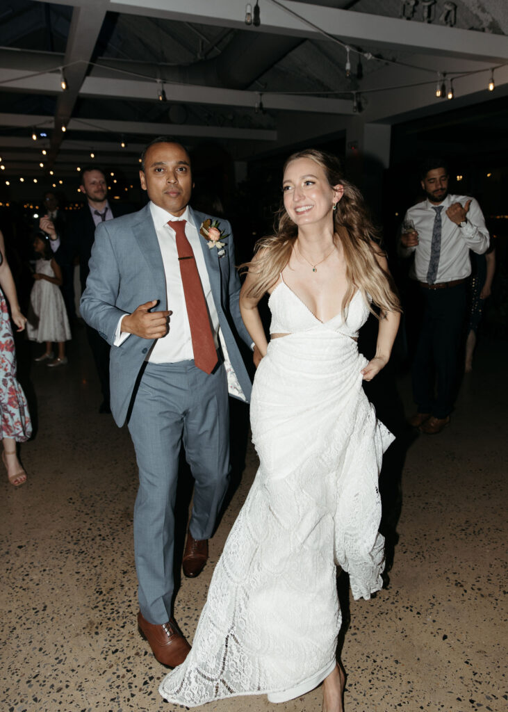 bride and groom dancing and having fun at their wedding reception