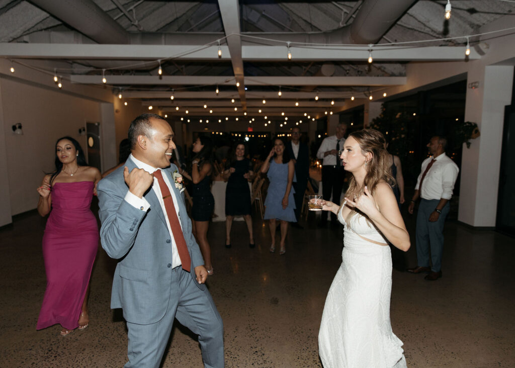 bride and groom dancing and having fun at their wedding reception