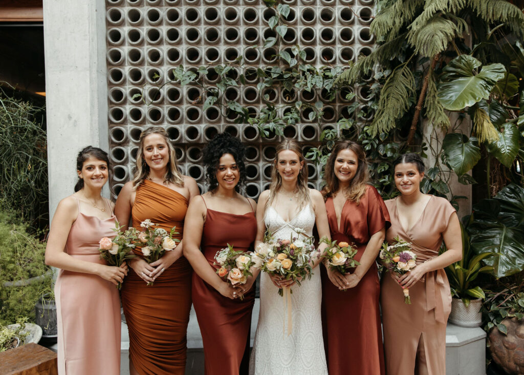 bride and bruidesmaids, mismatched terracotta bridemaid dresses