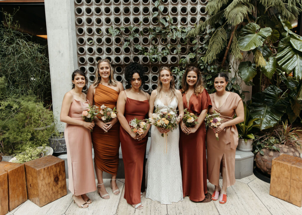 bride and bruidesmaids, mismatched terracotta bridemaid dresses