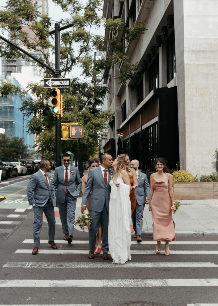 bride and groom and their wedding party roaming downtown brooklyn