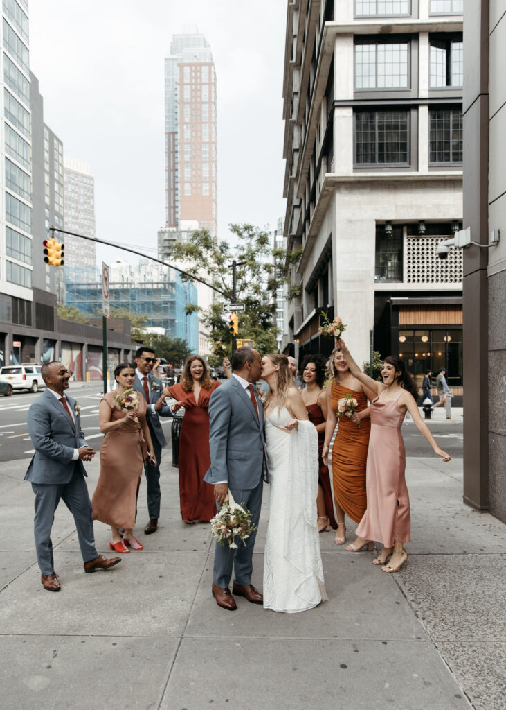 bride and groom and their wedding party roaming downtown brooklyn