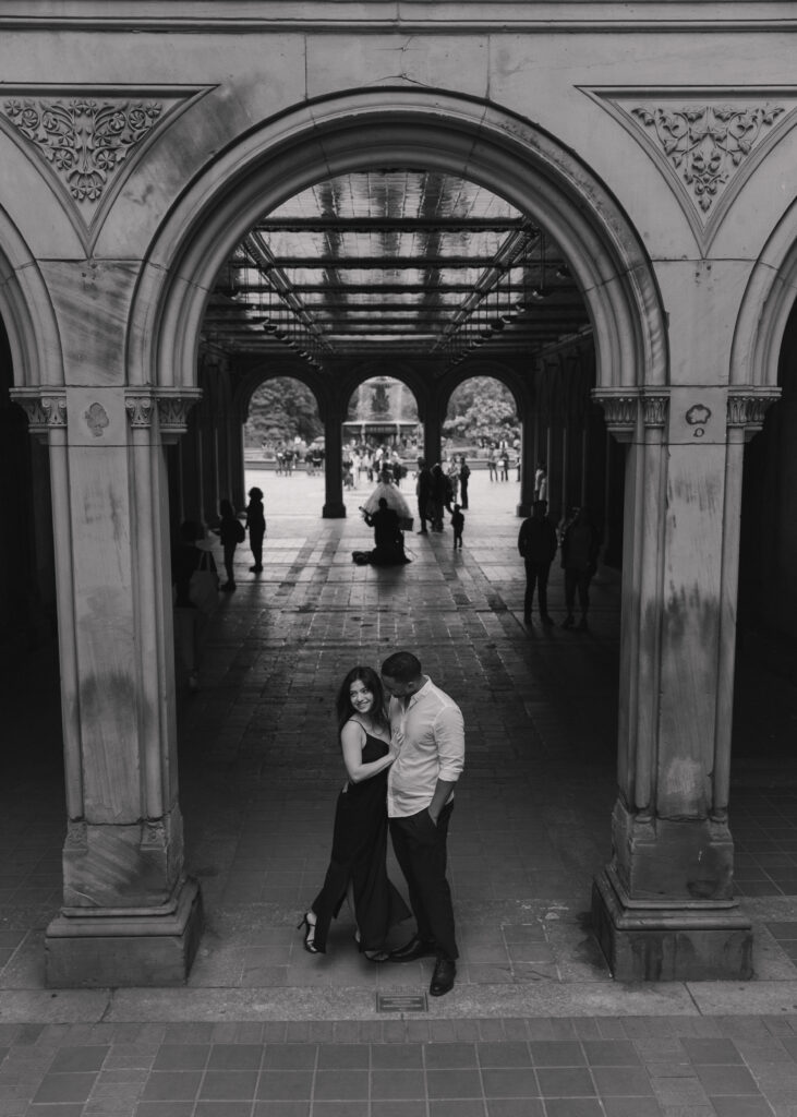 intimate black and white engagement photo at Bethesda Terrace, Central Park