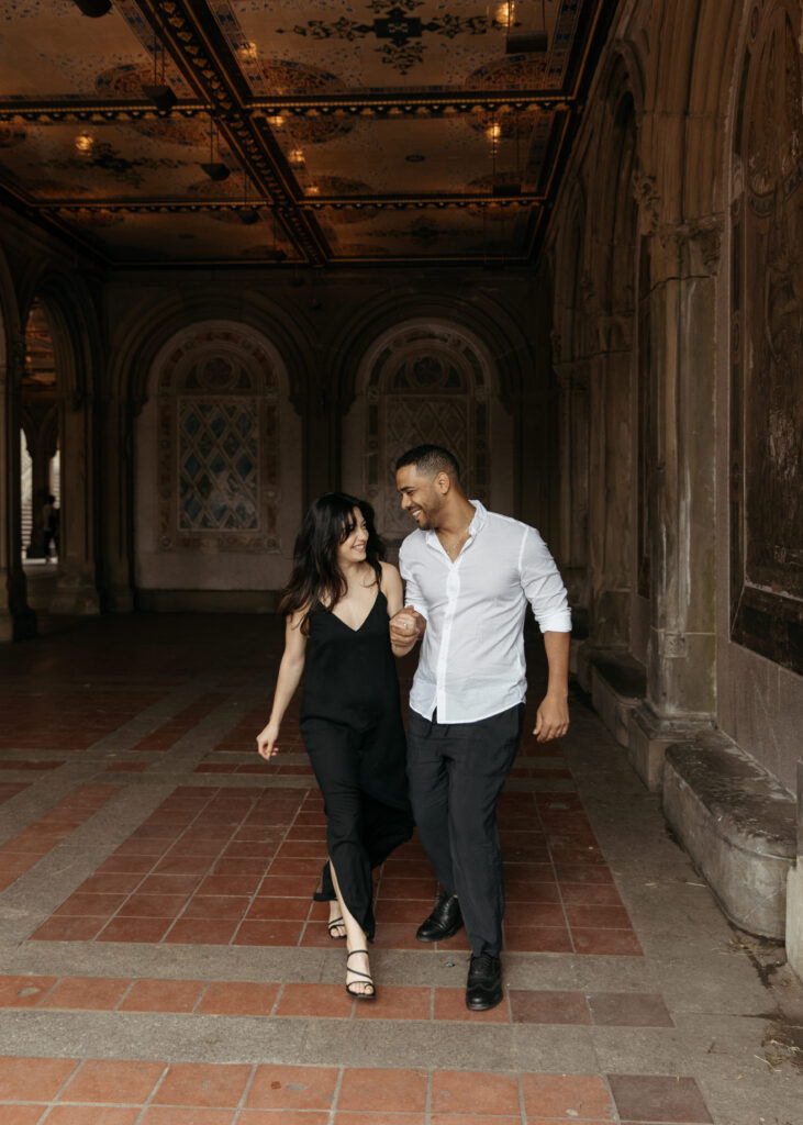 Central park engagement photos at Bethesda terrace with sleek black dress and classy casual vibes