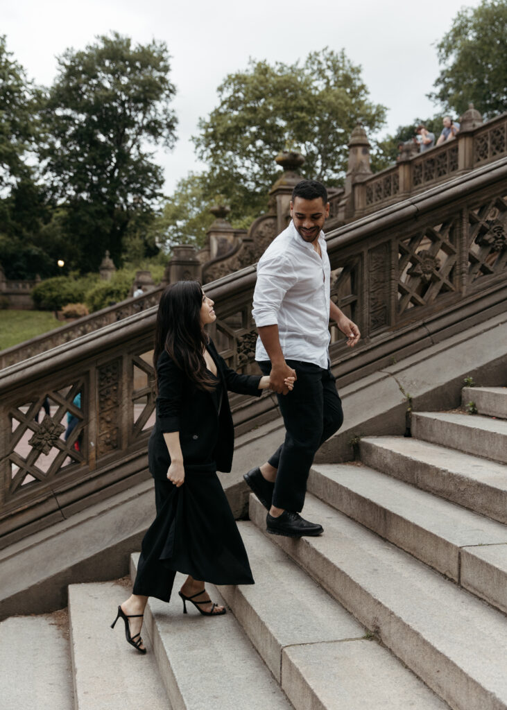 An elegant couple posing for their engagement photos in Central Park 