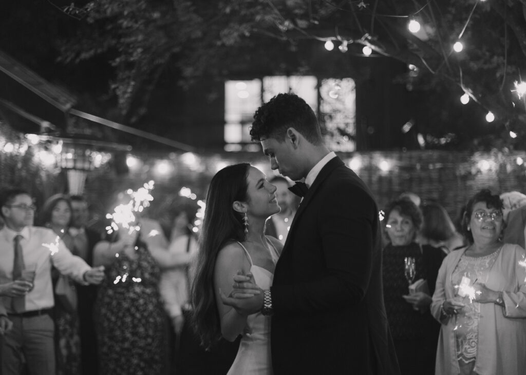 romantic restaurant wedding brooklyn first dance with sparklers in the backdrop