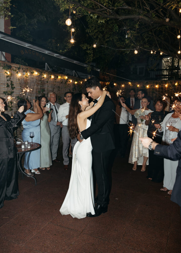 romantic restaurant wedding brooklyn first dance with sparklers in the backdrop