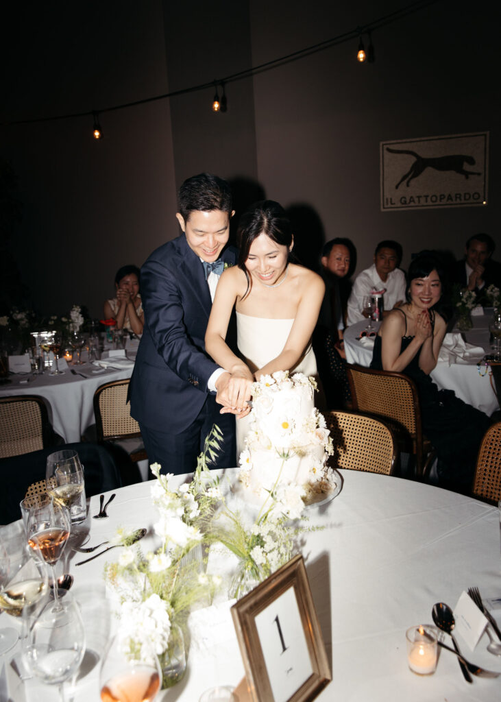 bride and groom cutting cake