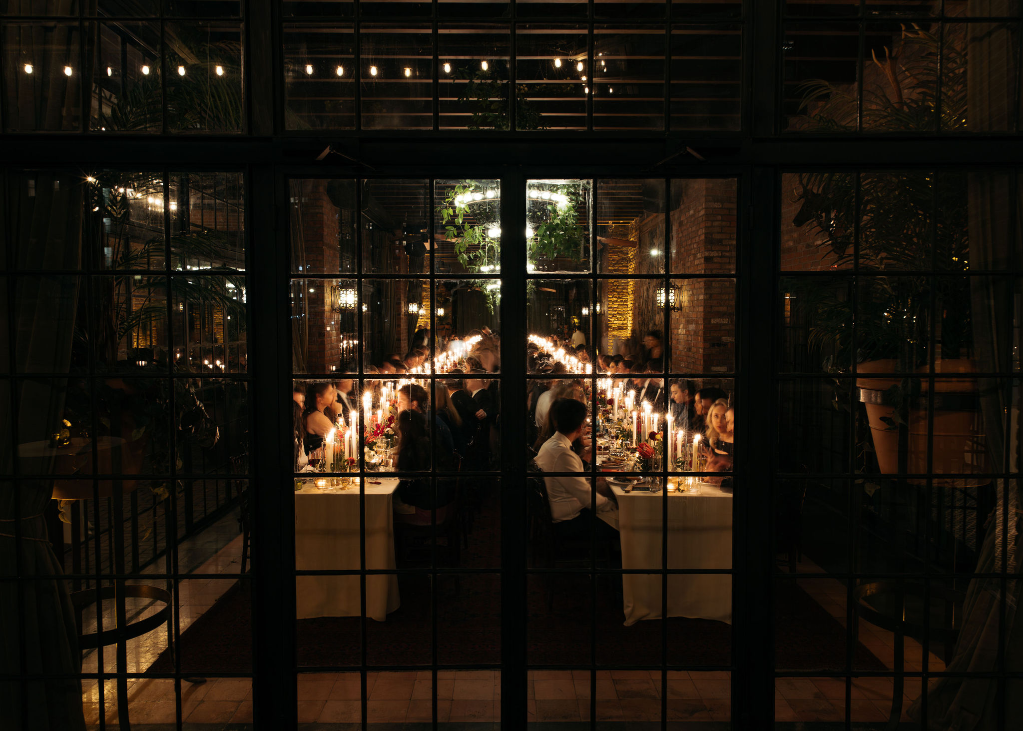 Bowery Hotel wedding guests dining and enjoying a romantic candle lit dinner 